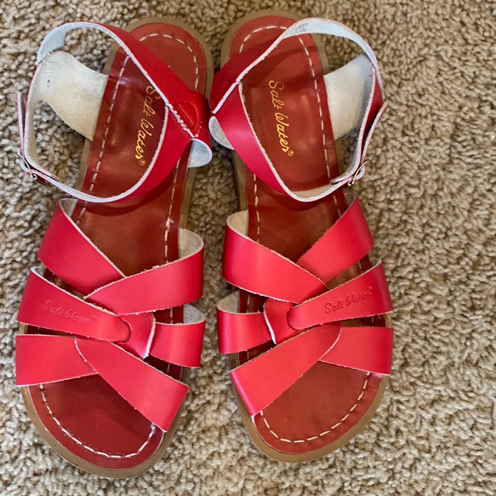 Salt water. The bottom of the sandal says 9,  but inside the strap it says W-11